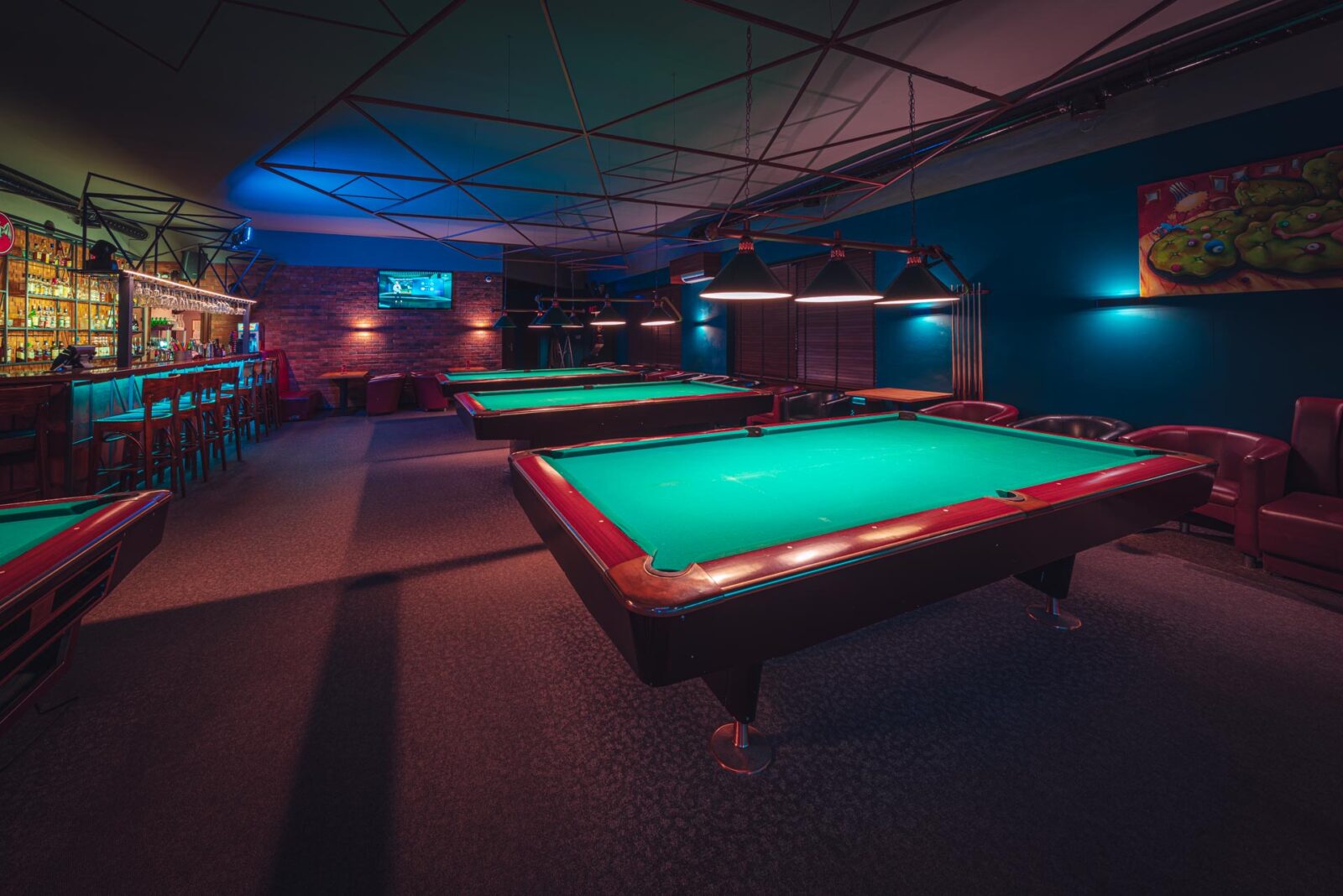 Pool tables beside the bar at Klub Pictures